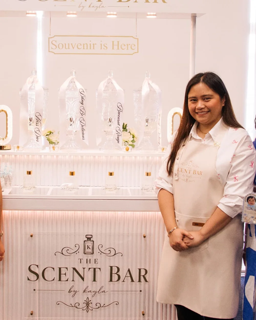 Jessa standing beside The Scent Bar by Kayla mobile perfume bar and crystal fragrance dispensers
